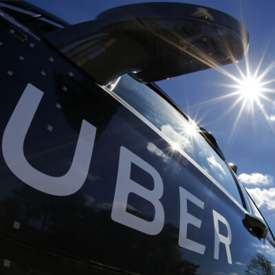 In this Monday, Sept. 12, 2016, file photo, a self-driving Uber sits ready to take journalists for a ride during a media preview in Pittsburgh. A federal criminal investigation into alleged espionage at Uber has indefinitely delayed a trial over whether the beleaguered ride-hailing service stole self-driving car technology from Waymo, a spinoff from Google. (AP Photo/Gene J. Puskar, File)