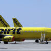 FILE - A line of Spirit Airlines jets sit on the tarmac at Orlando International Airport on May 20, 2020, in Orlando, Fla. The airline experienced significant delays on Thursday. (AP Photo/Chris O'Meara, File)