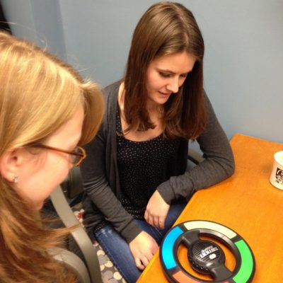 two women at a table looking at a 