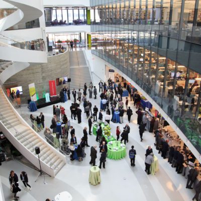 a crowd of people look at research projects at RISE 2019