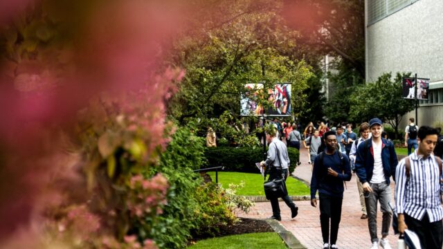 students walking to class on a rainy day