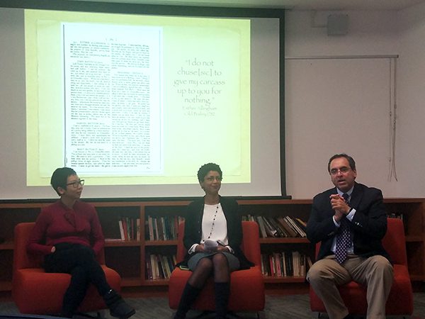 a picture of professor aljoe and two others presenting at the NUDream event