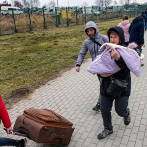 Ukrainian refugees are shown at the Medyka border in Medyka, Poland.