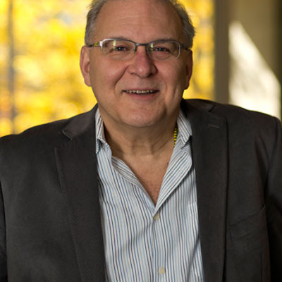 Headshot of Alan West-Duran
