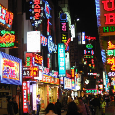 a cluster of colorful, bright neon signs at night in seoul, south korea