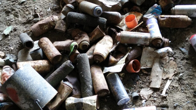 cans of spray paint and graffiti ephemera