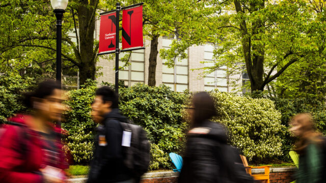 students walking through Snell Quad
