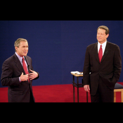 In this Oct. 17, 2000 file photo, Republican presidential candidate, Texas Gov. George W. Bush, left, speaks as Democratic presidential candidate Vice President Al Gore watches during their third and final debate.