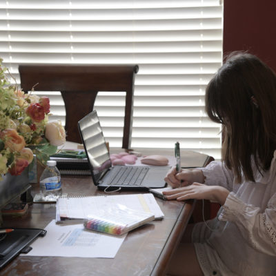 An Orange County Public Schools sixth-grade student participates in a virtual learning class from home, Thursday, Aug. 13, 2020, in Orlando, Fla. Early primary voting is underway in Florida.