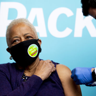 Margaret Burnham, university distinguished professor of law at Northeastern, receives a first dose of the Moderna COVID-19 vaccine at the Cabot Testing Center.