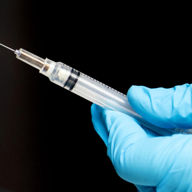 01/05/21 - BOSTON, MA: Nurse practitioner Jackie Fox prepares the Moderna COVID-19 vaccine to administrated at Northeastern’s testing center in Cabot Physical Education Center on Jan. 05, 2021.