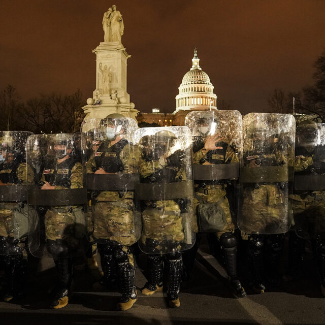 District of Columbia National Guard stand outside the Capitol, Wednesday night, Jan. 6, 2021, after a day of rioting protesters.
