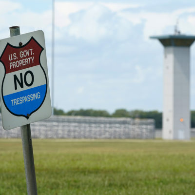 In this Aug. 28, 2020, file photo, a no trespassing sign is displayed outside the federal prison complex in Terre Haute, Ind.