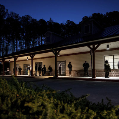 Voters wait in line to cast their ballots in Georgia's Senate runoff elections at a senior center, Tuesday, Jan. 5, 2021, in Acworth, Ga.