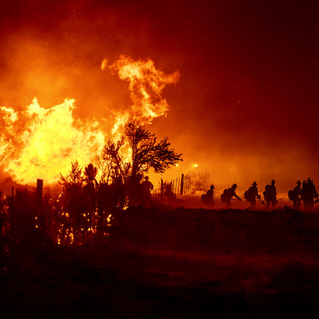 Firefighters battle the Sugar Fire, part of the Beckwourth Complex Fire, in Doyle, Calif., on Friday, July 9, 2021.