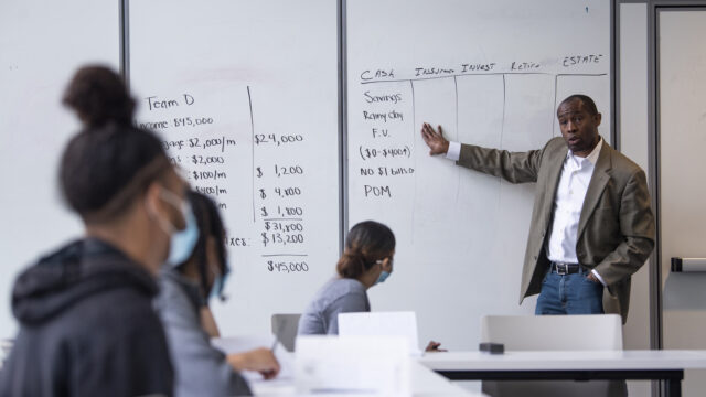 Northeastern economics graduate Nicholas Josey, executive director of the Vincita Institute, teaches a financial literacy course to Roxbury youth on Thursday, August 5, 2021at the Northeastern Crossing.