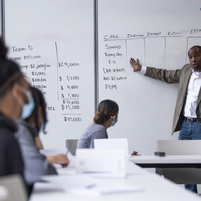 Northeastern economics graduate Nicholas Josey, executive director of the Vincita Institute, teaches a financial literacy course to Roxbury youth on Thursday, August 5, 2021at the Northeastern Crossing.