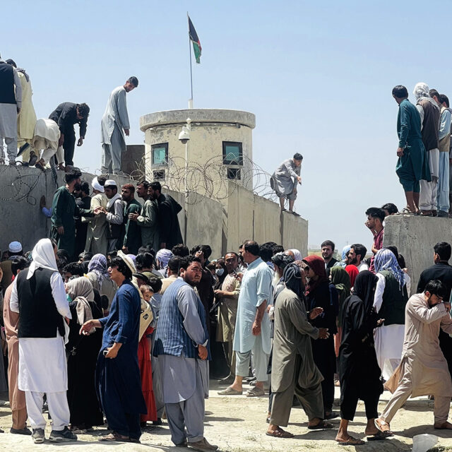 Thousands of Afghans rush to the Hamid Karzai International Airport as they try to flee the Afghan capital of Kabul, Afghanistan, on August 16, 2021.