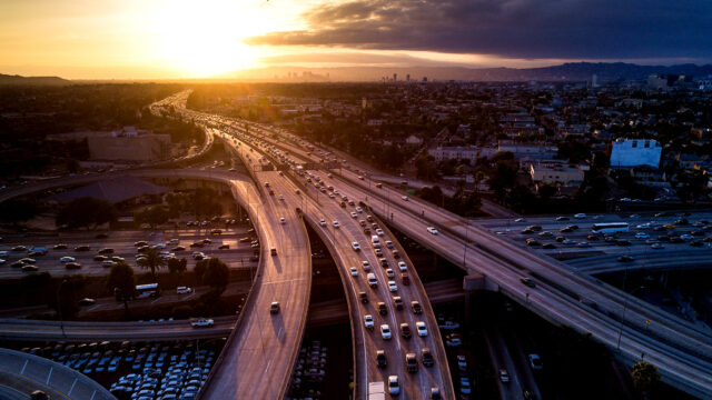 Drone shot of the I-10 / I-110 Interchange on the edge of Downtown Los Angeles at sunset.