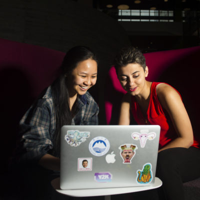 Danielle Nguyen, CISÕ19 and Niousha Jafari, CISÕ19, of NU Hacks work on a laptop in ISEC on May 9, 2017.