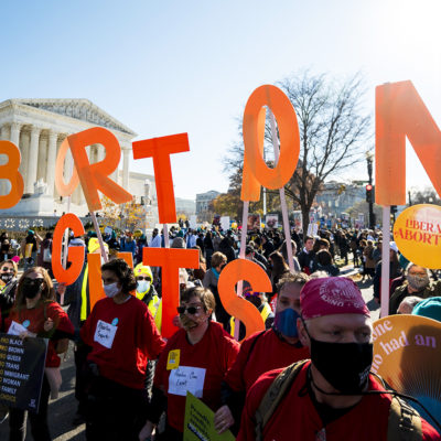 Reproductive rights activists hold abortion rights cut out letters as oral arguments in Dobbs v. Jackson Womens Health Organization case are held on Wednesday, December 1, 2021.