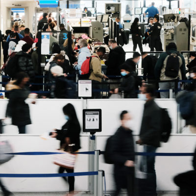 Travelers arrive for flights at Newark Liberty International Airport on November 30, 2021 in Newark, New Jersey.