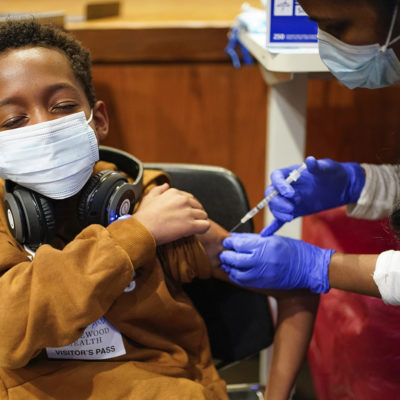 Cameron West, 9, receives a COVID-19 vaccination at Englewood Health in Englewood, N.J., Monday, Nov. 8, 2021.
