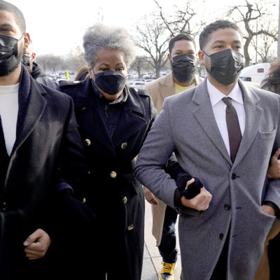 Actor Jussie Smollett, center, arrives with family Thursday, Dec. 2, 2021, at the Leighton Criminal Courthouse on day four of his trial in Chicago.