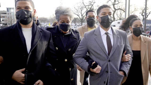 Actor Jussie Smollett, center, arrives with family Thursday, Dec. 2, 2021, at the Leighton Criminal Courthouse on day four of his trial in Chicago.