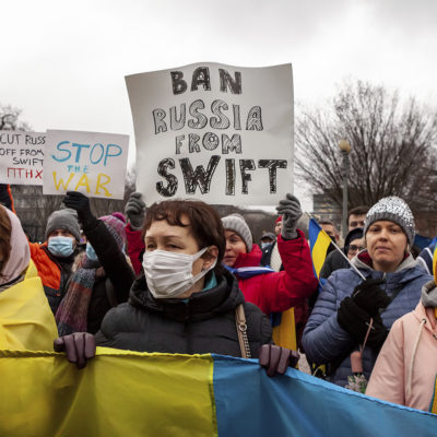 Protesters demand that Russia be banned from the SWIFT system during a rally for Ukraine at the White House.