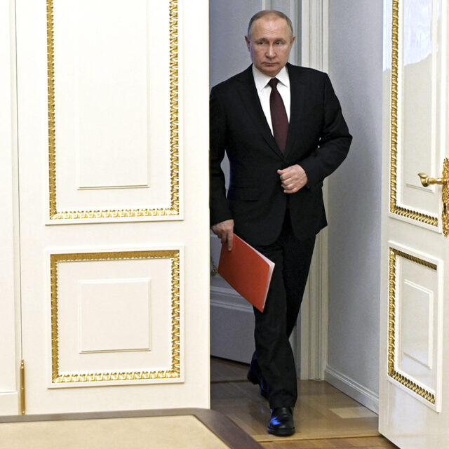 Russian President Vladimir Putin enters a hall to chair a Security Council meeting in Moscow, Russia, on Feb. 25, 2022.