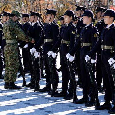Members of the Japan Ground Self-Defense Force (JGSDF) prepare ahead of an honour guard during a review at JGSDF Camp Asaka in Tokyo on November 27, 2021.
