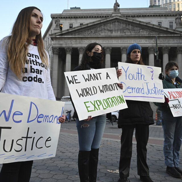 Demonstrators attend a rally during the Ghislaine Maxwell sex trafficking trial outside the Thurgood Marshall United States Courthouse in New York City.