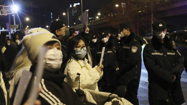 Hundreds of people stage a demonstration against Xi Jinping's zero-Covid policy at Liangmaqiao district in Beijing, China on Nov. 27, 2022. The Chinese government has faced unprecedented dissent protests in several cities, including Urumqi, Shanghai, and Beijing.