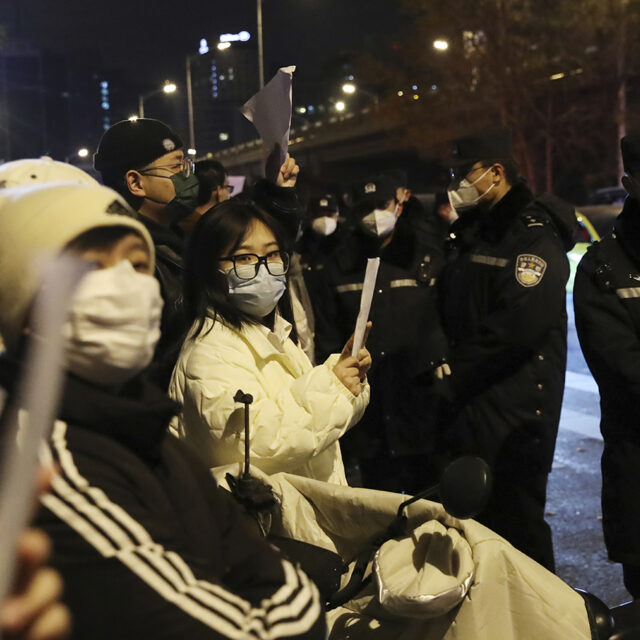 Hundreds of people stage a demonstration against Xi Jinping's zero-Covid policy at Liangmaqiao district in Beijing, China on Nov. 27, 2022. The Chinese government has faced unprecedented dissent protests in several cities, including Urumqi, Shanghai, and Beijing.