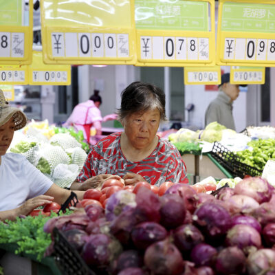 Consumers buy vegetables at a supermarket in Zaozhuang, East China’s Shandong province, Aug 9, 2023.
