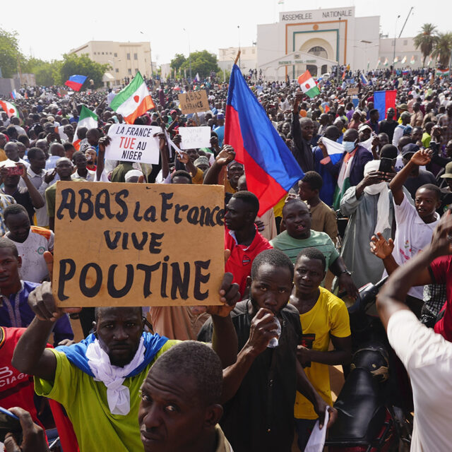 Nigeriens participate in a march called by supporters of coup leader Gen. Abdourahmane Tchiani in Niamey, Niger, Sunday, July 30, 2023.