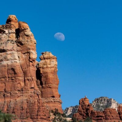 The moon rises over Sedona's iconic sandstone towers on June 6, 2023.