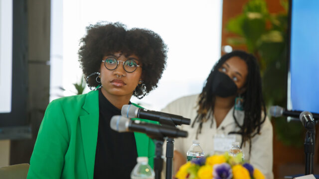 Jenia Browne (left) and another panelist (right) sitting at the 2023 bell hook Symposium.