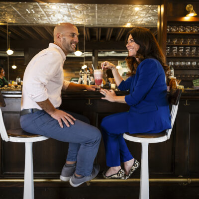 Northeastern alumni Christina and Ken Procaccianti work in the Providence location of Green Line Apothecary, a pharmacy and vintage soda fountain company they founded together, on Tuesday, Nov. 7, 2023.