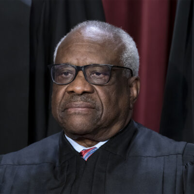 FILE - Associate Justice Clarence Thomas joins other members of the Supreme Court as they pose for a new group portrait, at the Supreme Court building in Washington, Oct. 7, 2022. Thomas is acknowledging that he took three trips last year aboard a private plane owned by Republican megadonor Harlan Crow. It’s the first time in years that Thomas has reported receiving hospitality from Crow. (AP Photo/J. Scott Applewhite, File)