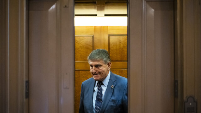 Senator Joe Manchin (D-W.V.) boards an elevator after casting a Senate vote, at the U.S. Capitol, in Washington, D.C., on Tuesday, November 7, 2023.