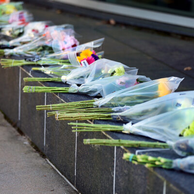 October 28: Bouquets of flowers grace a wall near the entrance to Central Maine Medical Center to commemorate those killed and injured in the mass shooting in Lewiston.