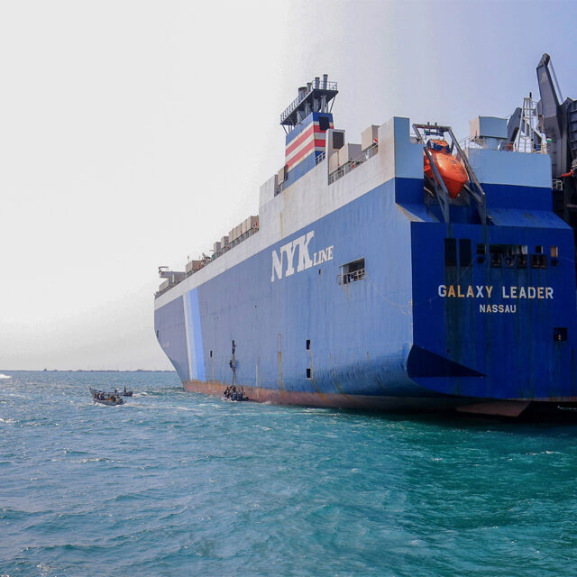 A picture taken during an organised tour by Yemen's Huthi rebels on November 22, 2023 shows the Galaxy Leader cargo ship, seized by Huthi fighters two days earlier, at a port on the Red Sea in Yemen's province of Hodeida. The Bahamas-flagged, British-owned Galaxy Leader, operated by a Japanese firm but having links to an Israeli businessman, was headed from Turkey to India when it was seized and re-routed to Hodeida November 19, according to maritime security company Ambrey. The Huthis said the capture was in retaliation for Israel's war against Hamas, sparked by the October 7 attack by the Palestinian militants who killed 1,200 people and took around 240 hostages, according to Israeli officials. (Photo by AFP) (Photo by -/AFP via Getty Images)