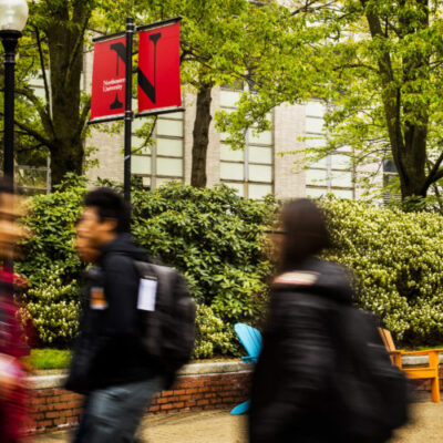 Students walk through Snell Quad on May 14, 2019.