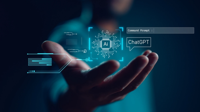 Image of a hand holding a graphic that displays the ChatGPT logo.