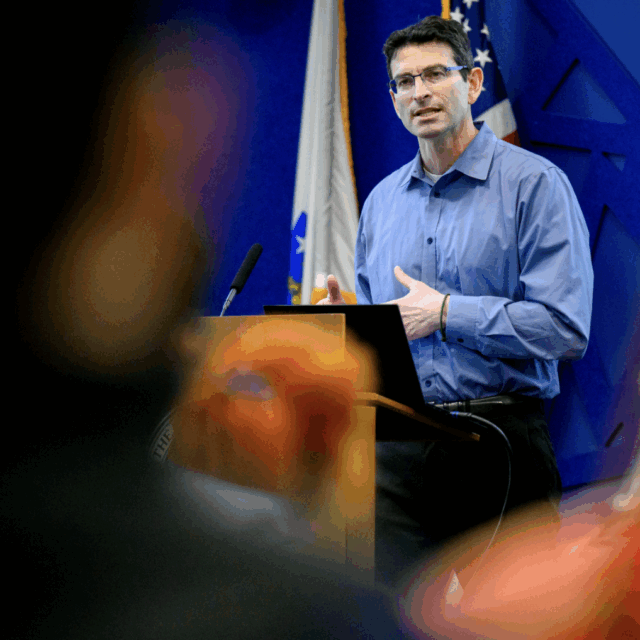 image of professor ronald sandler speaking in front of crowd at john d o'bryant institute
