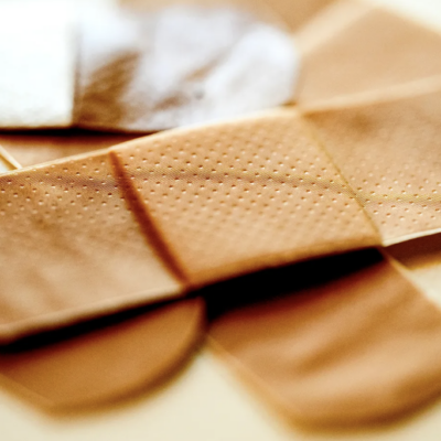 image of three bandaids that have consumer reports raise awareness about harmful chemicals in personal care products and incentivize policymakers to come up with regulations.