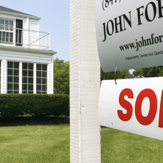 image of house with sold sign outside with caption 