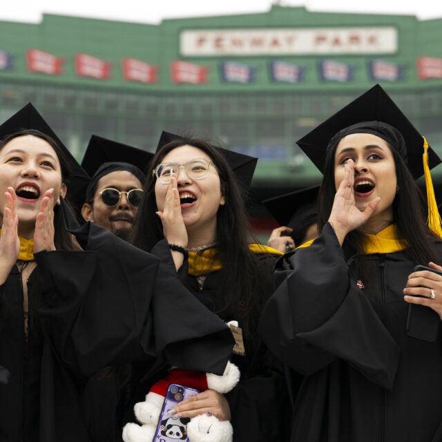 image of three graduates at fenway celebration